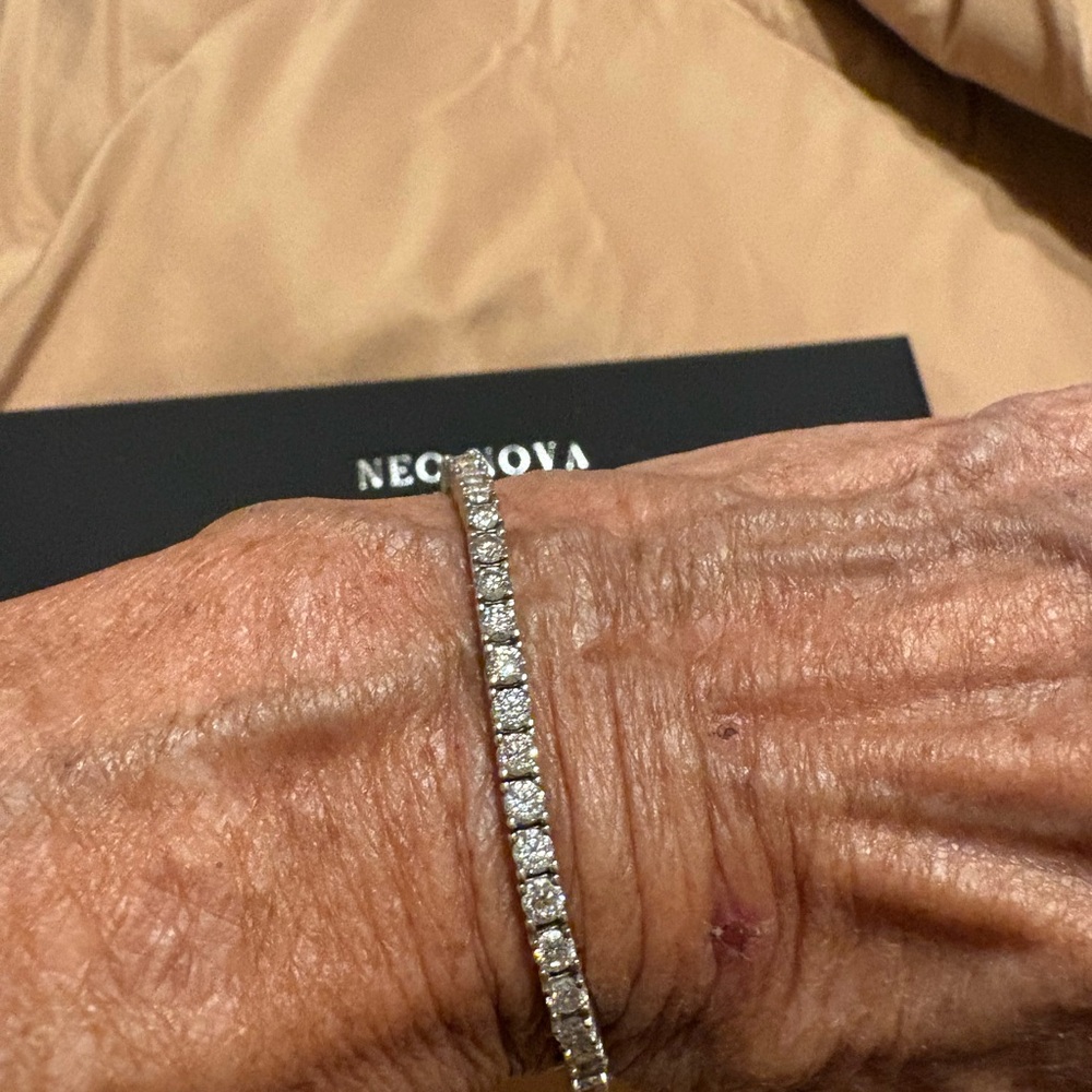 Authentic Moissanite bracelet set in SS very sparkly, Like new great for a gift.